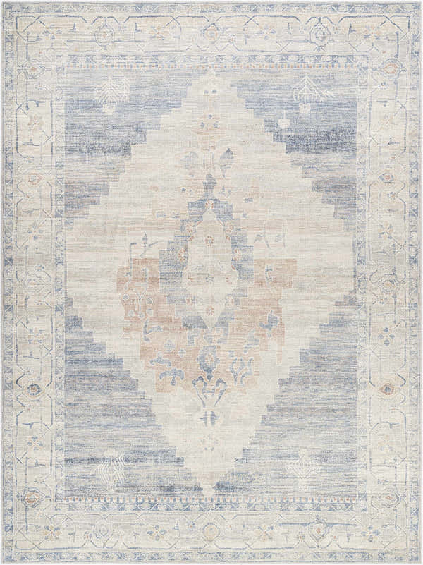 Close-up of the Luca Machine Woven Becki Owens x LIVABLISS BONC-2300 Area Rug. Denim, ivory, and brown traditional pattern. Design-Rectangle-9212