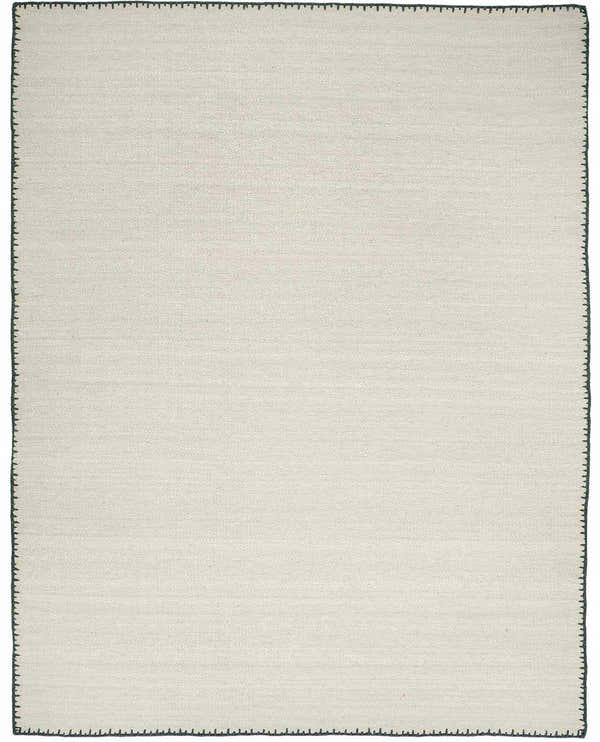 Close-up of the hand woven Ayumu Off White Wool Area Rug, showing texture and charcoal stitched border. Design-Rectangle