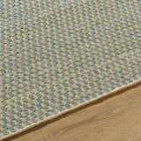 Close-up of the Verdel Sage rug showing its hand-woven texture, sage, tan, and teal colors, and farmhouse style. Texture