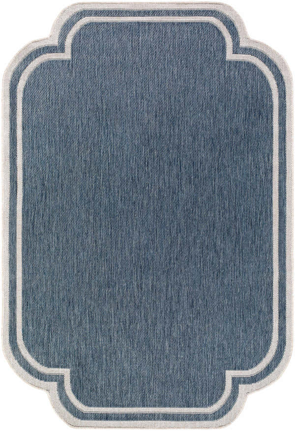 Close-up of the Arnola Blue Outdoor Rug. Features a blue woven texture and cream quatrefoil border. Design-Rectangle-537