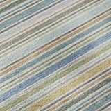 Close-up of Dalyn Luxury Soft Essentials Seaside rug featuring a striped pattern in blue, green, brown, and gray.