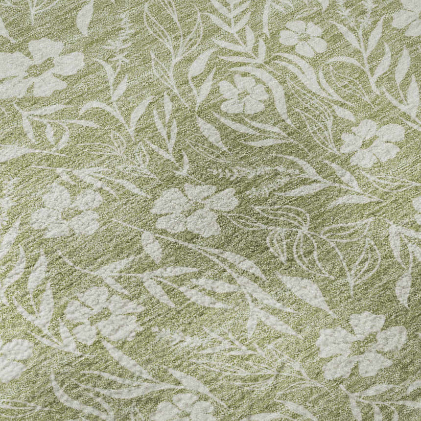 Close-up of the Dalyn Luxury Soft Essentials Aloe rug, showing a floral and leaf pattern in aloe green and white.