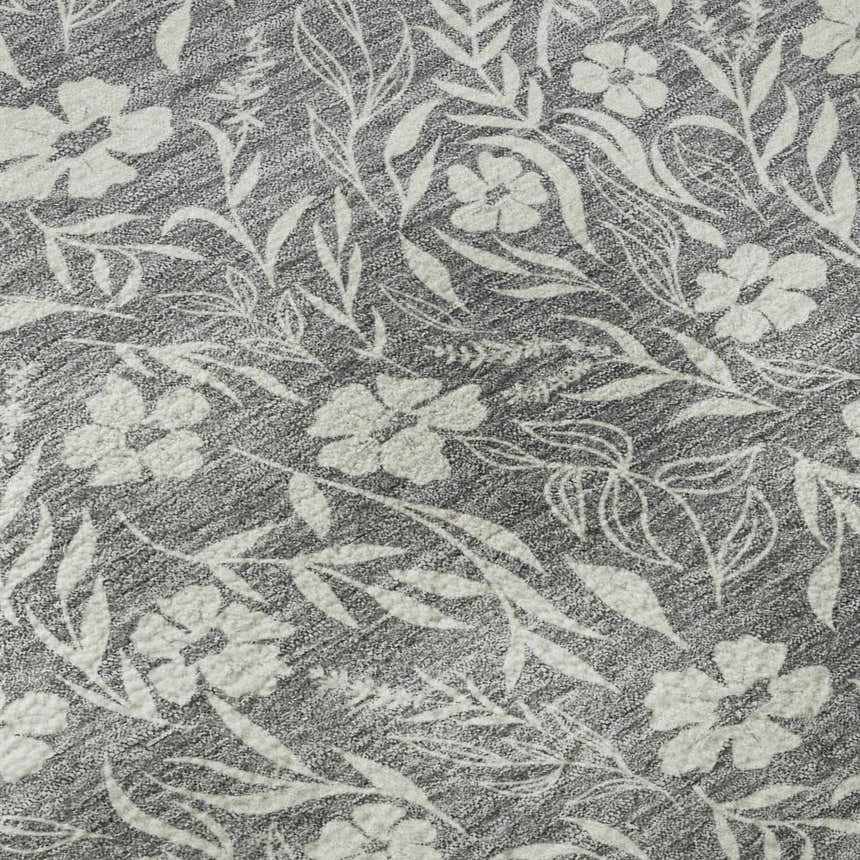 Close-up of Dalyn Luxury Soft Essentials Gray Washable Area Rug featuring a floral and leaf pattern.