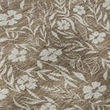 Close-up of Dalyn Luxury Soft Essentials SE4 Mocha Washable Area Rug. Light brown with a white floral and leaf pattern.