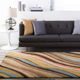 Living room scene with a Seminole Area Rug in beige, brown, and teal, styled with a gray sofa and modern decor. Roomscene-Rectangle