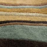 Close-up of the Seminole Area Rug showing the hand-tufted texture and striped pattern in beige, brown, teal, and mustard tones. Texture