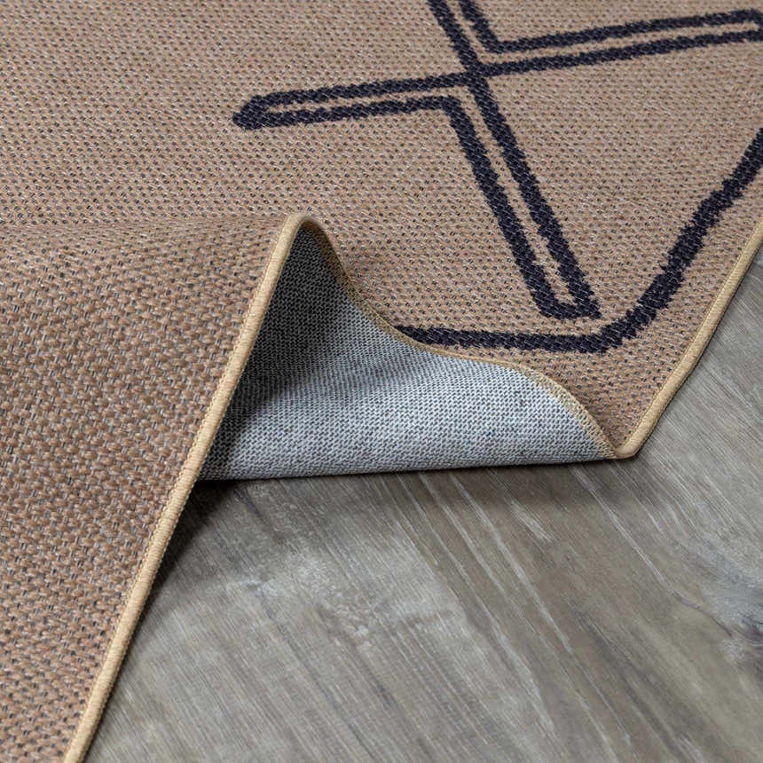 Close-up of the Hamid Washable Jutely Rug showing camel color, jute texture, and dark brown geometric pattern. Fold