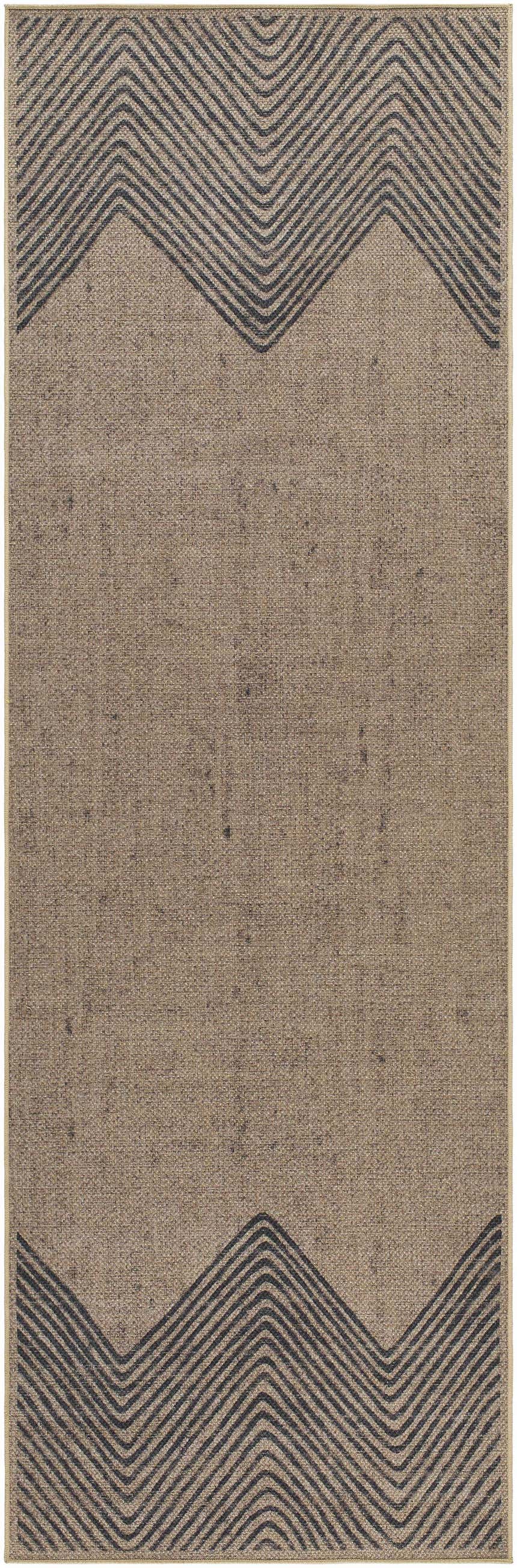 Close-up of the Suzy Washable Jutely Rug in camel. Features a geometric, dark brown zig-zag pattern on a jute-textured background. Design-Runner-268