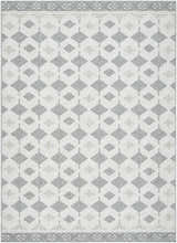Close-up of the Salil Ivory Area Rug. Features a geometric diamond pattern in cream, ivory, and light gray. Design-Rectangle-537