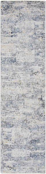 Close-up of the Hyman Area Rug, featuring a contemporary abstract design in camel, gray, and denim hues. Design-Runner-2710