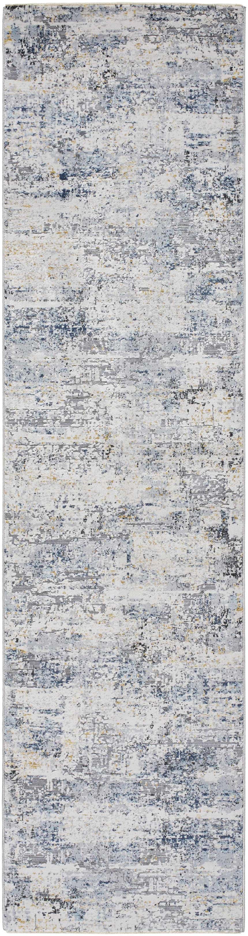 Close-up of the Hyman Area Rug, featuring a contemporary abstract design in camel, gray, and denim hues. Design-Runner-2710