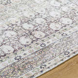 Close up of the Mabyn Area Rug showing its vintage-inspired design and neutral color palette. Texture