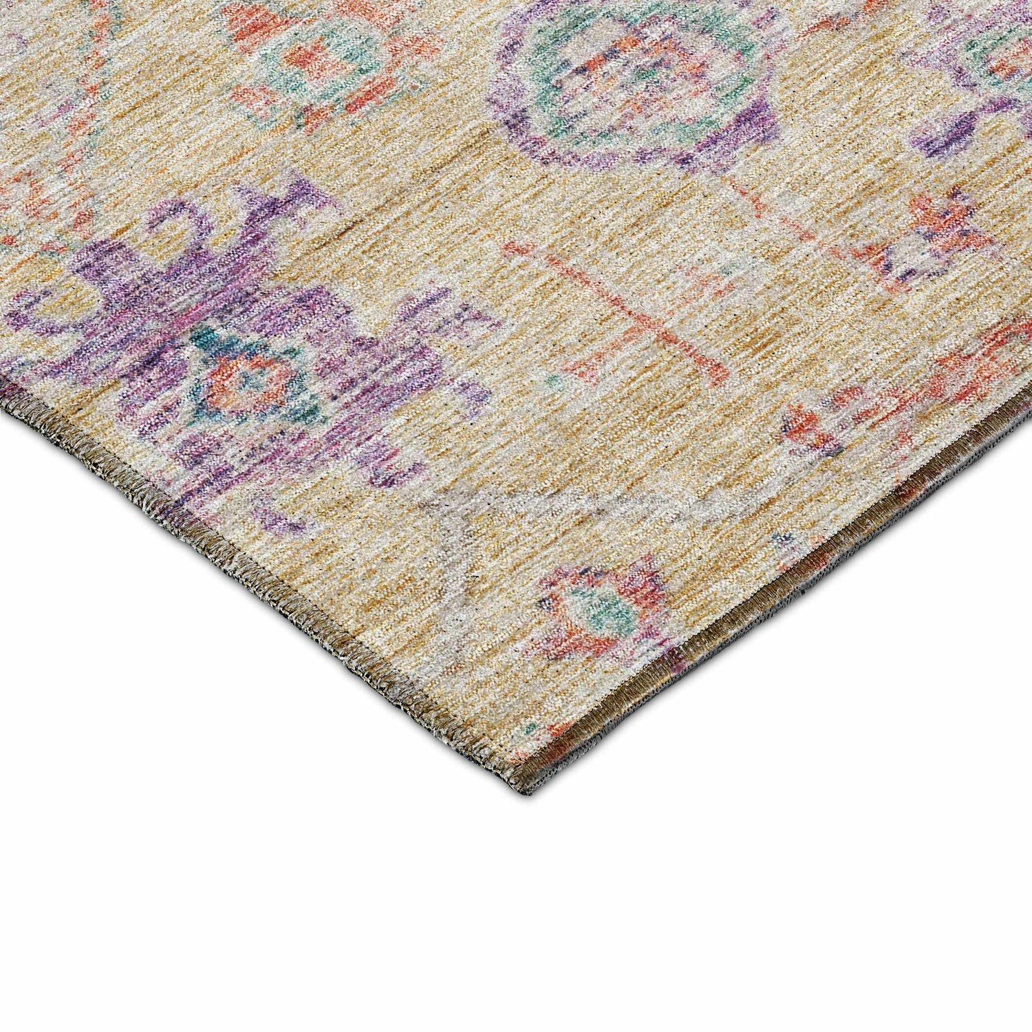 Close-up of the Dalyn Luxury Solace SL10 Peach Washable Area Rug showing peach, purple, and teal floral pattern.