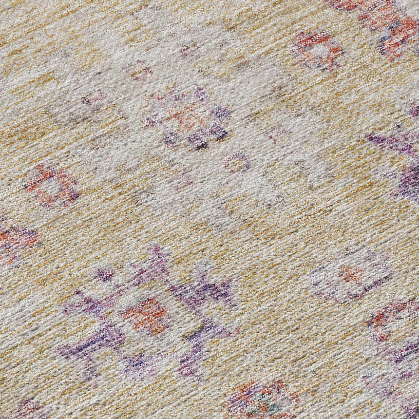 Close-up of the Dalyn Luxury Solace SL10 Peach Washable Area Rug. Features blush pink, caramel, and peach floral patterns.