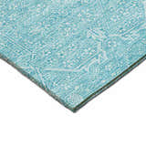 Close-up of Dalyn Luxury Solace SL12 Sky Washable Area Rug. Sky blue rug with a faded, traditional pattern.