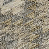 Close-up of Dalyn Luxury Solace SL13 beige washable rug. Abstract pattern in beige, chestnut, ivory, and taupe.