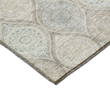 Close up of the Dalyn Luxury Solace SL1 Taupe Washable Area Rug. Beige, chestnut, and light brown medallion pattern.