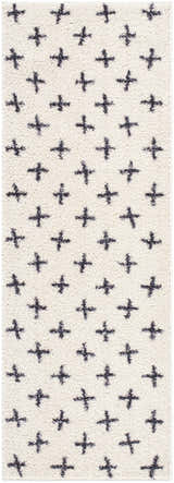 Close-up of the Bede Washable Area Rug. Beige shag rug with a charcoal plus sign geometric pattern. Contemporary style. Design-Runner-2773