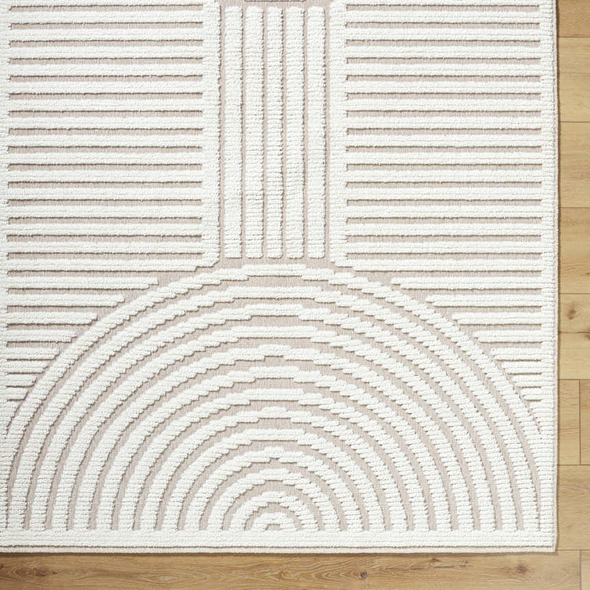 Close-up of the Deron Ivory 3D Rainbow Washable Rug. Off-white raised geometric design on a light gray background. Corner