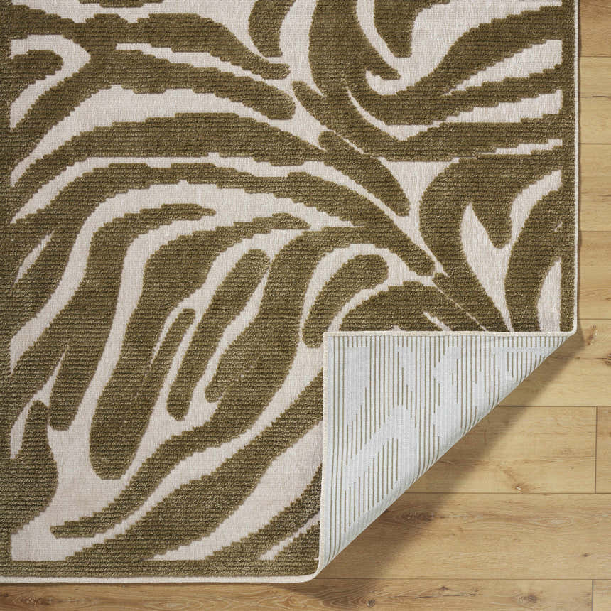 Close-up of the Keto Olive Washable Area Rug showing the off-white and olive contemporary pattern and machine woven texture. Fold