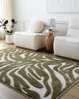 Living room scene with a Keto Olive Washable Area Rug, white chairs, wood floors, and neutral decor. Roomscene-Rectangle