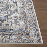 Close-up of the Paula Off White Area Rug showing its charcoal, mustard, and rust traditional pattern. Front