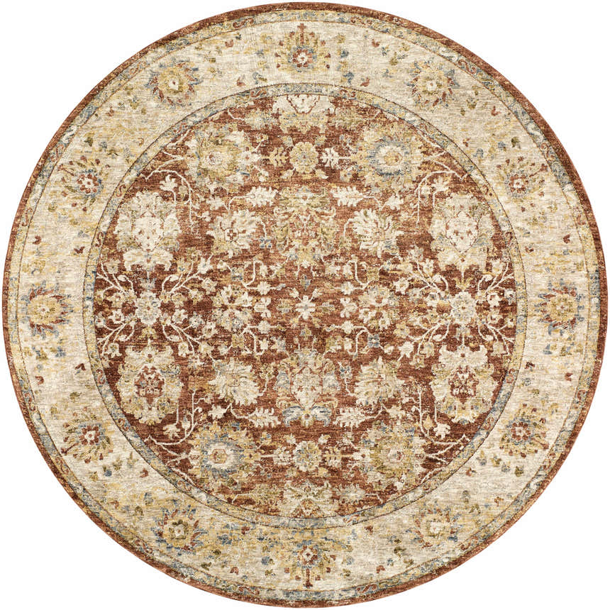 Close-up of a round Duong Rust Textured Rug. The rug has a traditional floral pattern in brick red, sage, and tan. Design-Round-710
