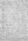 Close-up of the Jenis Gray Luxe Rug, a machine-woven rug with light and natural gray tones and a subtle traditional pattern. Design-Rectangle