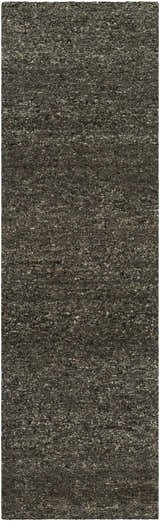 Close-up of the Sevan Black Wool Area Rug. Features a textured, hand-tufted design in jet black, medium gray, and taupe. Design-Runner-310