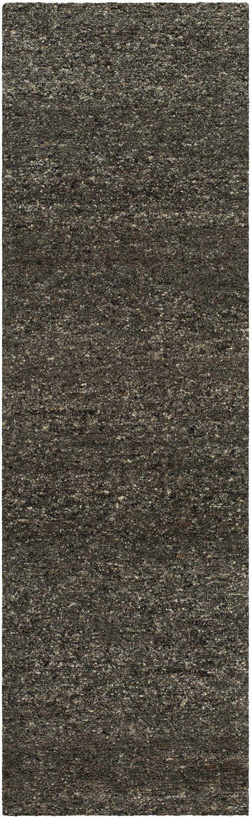 Close-up of the Sevan Black Wool Area Rug. Features a textured, hand-tufted design in jet black, medium gray, and taupe. Design-Runner-310
