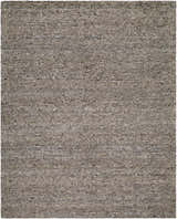 Close-up of the hand-tufted Sevan Taupe Wool Area Rug. Neutral taupe color with subtle texture and wool fibers. Design-Rectangle-810