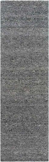 Close-up of the Sevan Charcoal Wool Area Rug, showing the gray, black, and steel gray tones and hand-tufted texture. Design-Runner-310