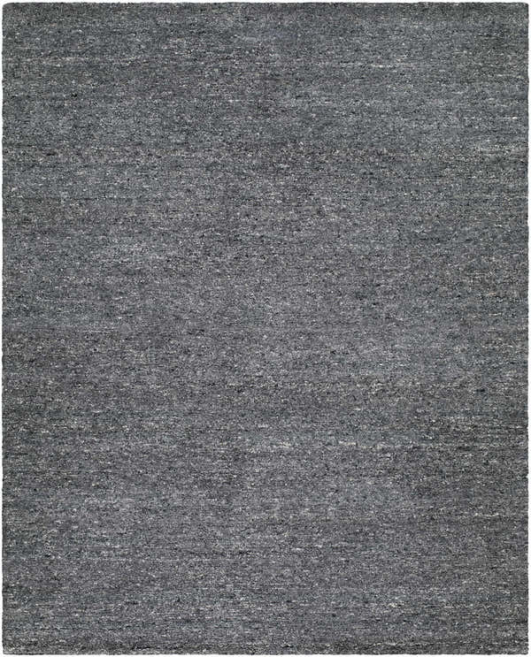 Close-up of the hand-tufted Sevan Charcoal Wool Area Rug. Features black, gray, and steel gray tones. Design-Rectangle-810
