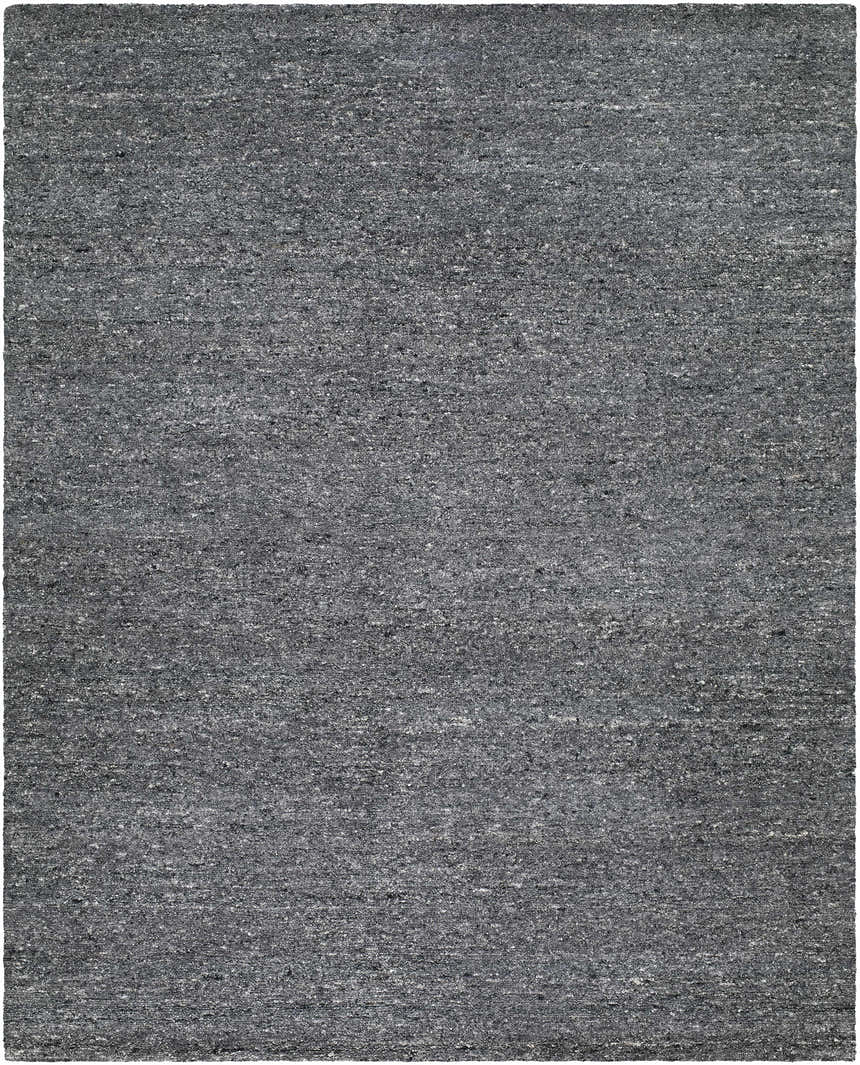 Close-up of the hand-tufted Sevan Charcoal Wool Area Rug. Features black, gray, and steel gray tones. Design-Rectangle-810