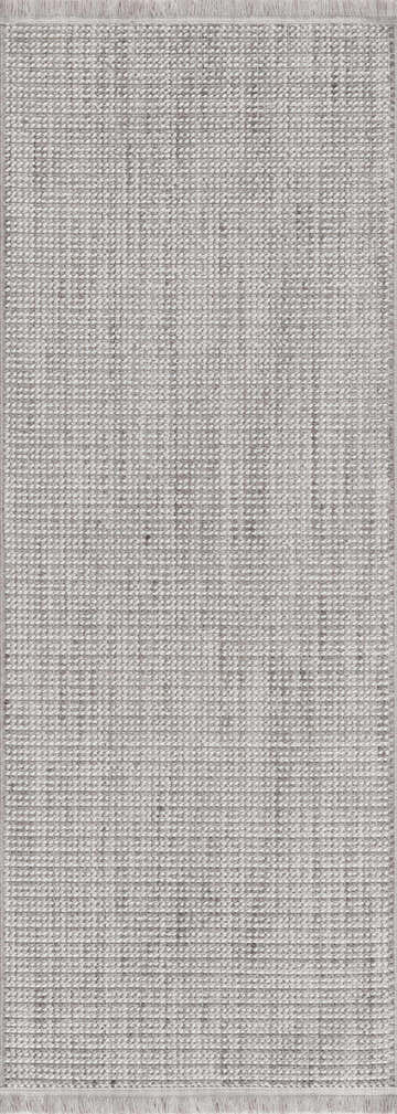Close-up of the Gowan Cream Area Rug. Neutral beige and gray tones with a woven texture and fringe detail. Design-Runner-2773