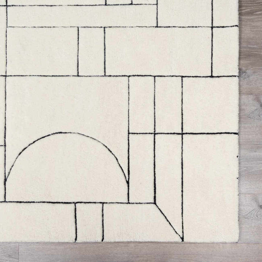 Close-up of Fusao Rose Cream Area Rug featuring a geometric black line pattern on a beige wool texture. Swatch