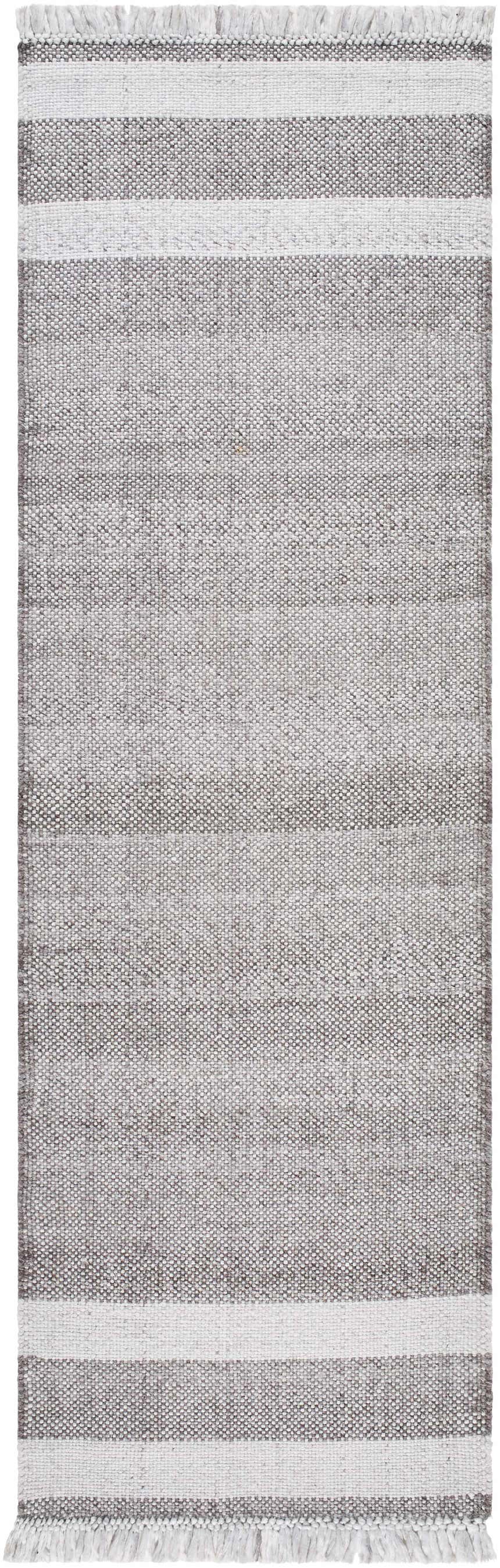 Close-up of the hand woven Loic Light Brown Area Rug, featuring a striped design and fringe. Design-Runner-268