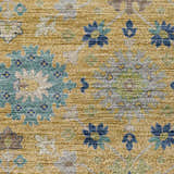 Close-up of the Dalyn Indoor/Outdoor Silk Road SR3 Turmeric Area Rug. Features a floral pattern in turmeric, blue, ivory, and green.