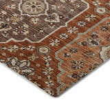 Close up of Dalyn Silk Road SR7 Paprika area rug showing caramel, gold, and paprika floral pattern.