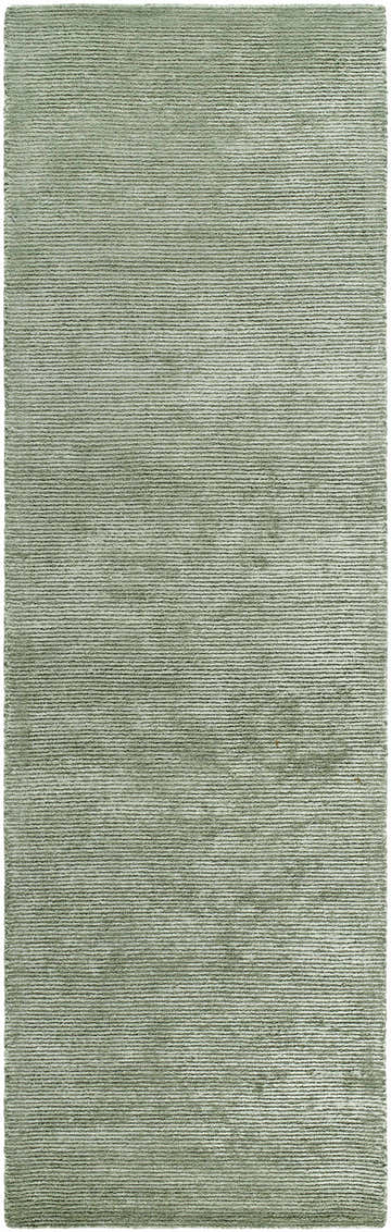 Close-up of the Helio Area Rug in sage. Hand-tufted viscose rug with a subtle horizontal stripe pattern. Design-Runner-310
