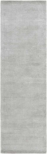 Close-up of the hand-tufted Noham Area Rug. Metallic silver, pale slate, and silver gray viscose create a contemporary design. Design-Runner-310