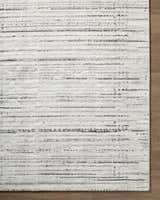 Close up of the Salus Luxe Rug. Beige and cream rug with a contemporary black stripe pattern. Swatch