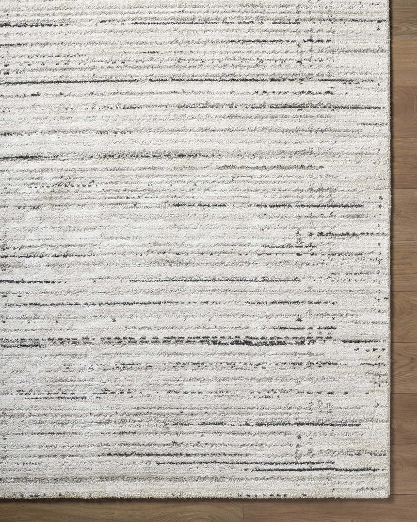 Close up of the Salus Luxe Rug. Beige and cream rug with a contemporary black stripe pattern. Swatch