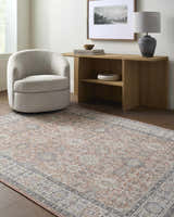 Living room scene with a light gray chair and Adilet Dark Pink Washable Area Rug. Roomscene-Rectangle