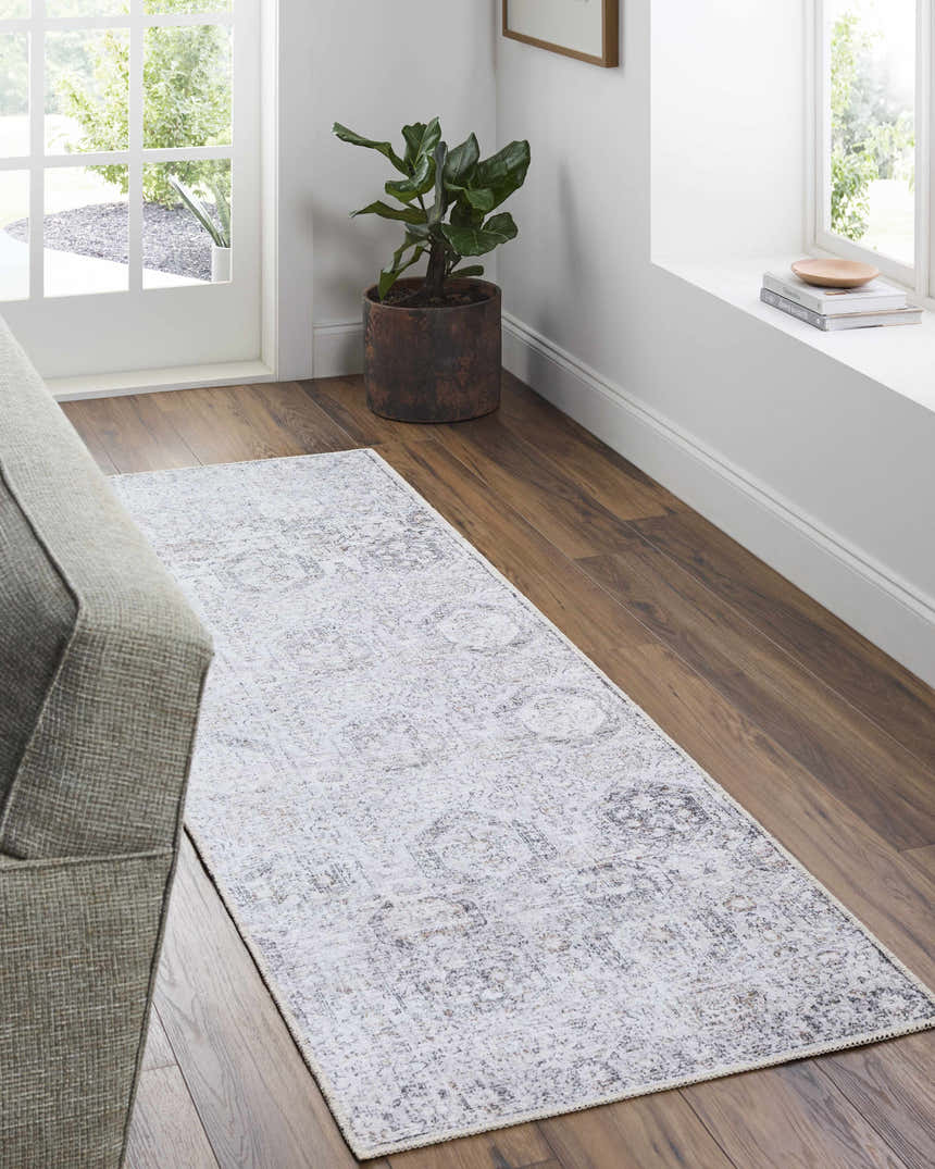 Entryway with gray sofa and Washable Parkerfield Area Rug runner in gray, white, and brown on hardwood floor. Roomscene-Runner