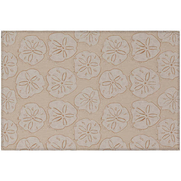Close-up of Dalyn Seabreeze SZ10 Peach Washable Area Rug with a sand dollar pattern. Coastal style.
