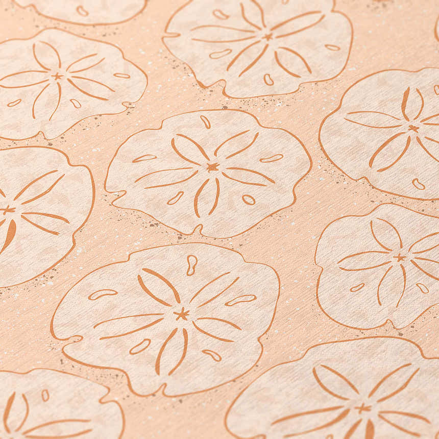 Close up of the Dalyn Seabreeze SZ10 Peach Washable Area Rug featuring a sand dollar pattern.
