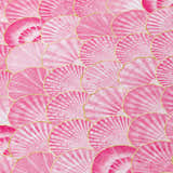 Close-up of Dalyn Seabreeze Blush rug showing pink seashell pattern with gold accents. Coastal style.