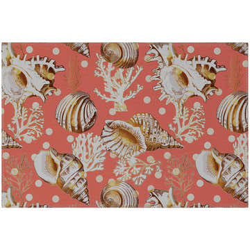 Close-up of the Dalyn Seabreeze Salmon Washable Area Rug featuring a seashell, coral, and polka dot pattern.