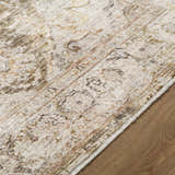 Close-up of the Avelyn Area Rug showing cream, dark brown, and red tones in a traditional, machine-woven pattern. Texture